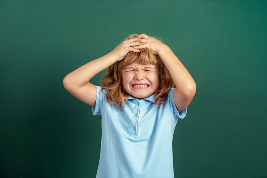 Child shouting. Little boy is screaming, crying a lot. Children's whims, tantrums. Headache. Boy touching head and have a migraine. Angry little boys with sad expressions, screaming, crying, cry