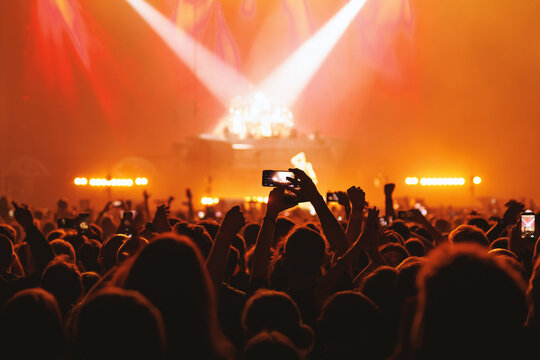 Silhouette of Crowd with Smartphones Raised at Live Music Concert