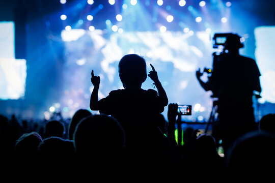 Audience Applauding with Hands Up at Orange Music Festival