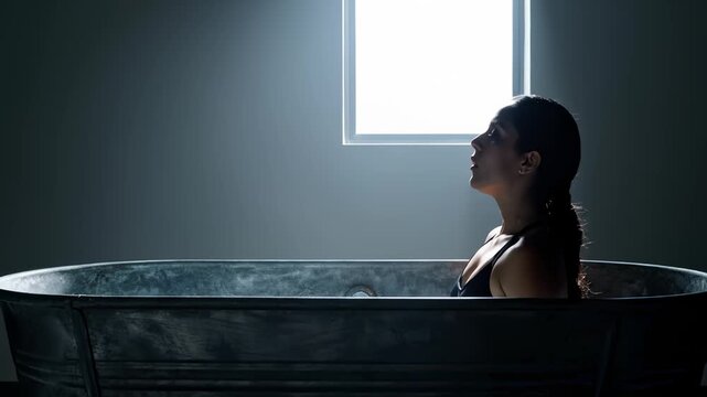 Athletic Woman Taking An Ice Bath For Muscle Recovery After Workout