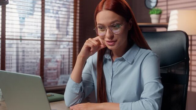 Caucasian business woman looking laptop screen reading email with good news feeling wonder smiling look in monitor in office businesswoman female girl read chat in computer amazed satisfied smile