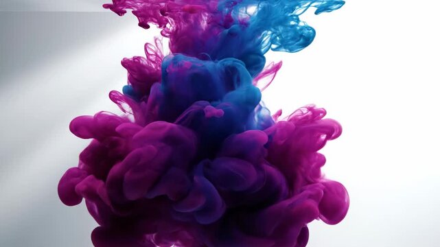 Colorful ink clouds mixing in water, abstract fluid dynamics, vibrant purple and blue swirls, macro detail, dynamic motion, perfect for backgrounds and design elements