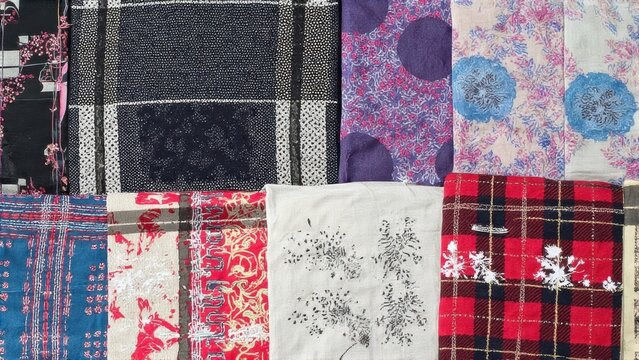 An assortment of colorful quilt squares with diverse patterns and designs, suitable for home decor or as artistic textile projects.