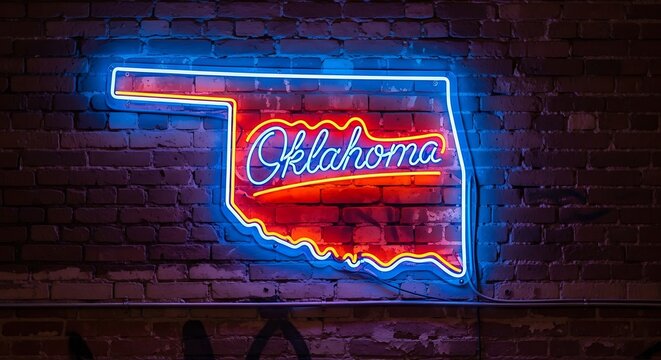 Oklahoma state outline illuminated by vibrant neon light sign against dark brick wall background