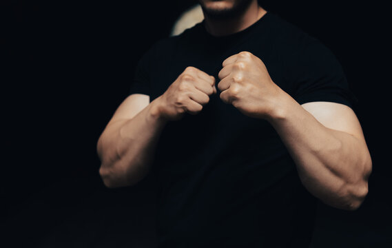 People training for self-defense techniques in a focused fitness environment, practicing defensive movements, strength, agility, and awareness for personal safety and confidence.