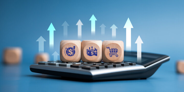 Economic crisis concept with inflation icons on wooden cubes over financial calculator, rising interest rates and market volatility.