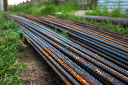 Strong metal rods used in construction work, designed for structural support, reinforcement, and durability in building projects and engineering applications.
