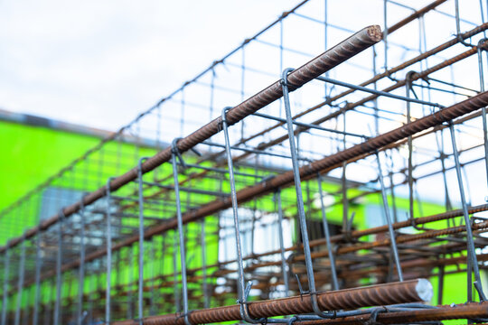 Strong metal rods used in construction work, designed for structural support, reinforcement, and durability in building projects and engineering applications.
