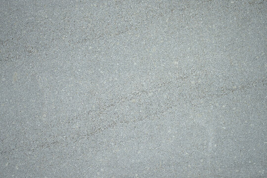 Minimal gray background with smooth neutral texture, modern abstract backdrop for design projects, studio presentation, advertising, and clean professional visual concept.