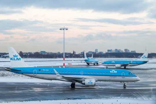 KLM regional jet on Schiphol apron during winter operations