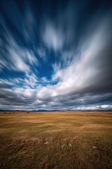 Fototapeta premium Vast grassland landscape on the Tibetan plateau under dramatic clouds