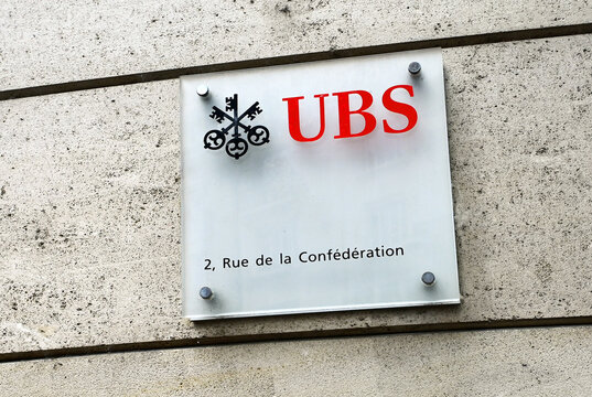 Geneva, Switzerland, Europe - 05.2026 : Three-keys logo (symbols of confidence, security, and discretion) and name of UBS bank, information with logo, facade of UBS branch, Rue de la Conf&eacute;d&eacute;ration 