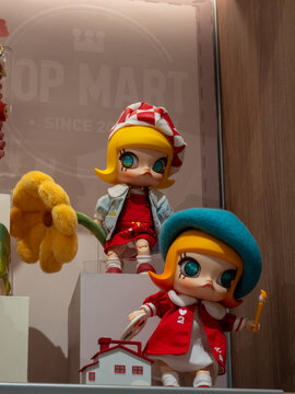 Two POP MART Molly BJD Painter Dolls Displayed in Store Showcase