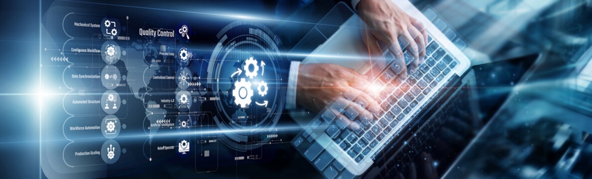 Operations manager using a laptop to analyze automation workflows. This development streamlines repetitive tasks, increasing overall productivity and reducing human error in the supply chain.