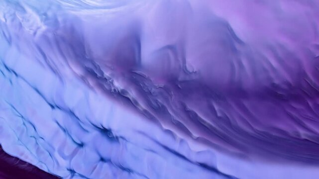 Alcohol ink is being used to create an abstract art piece through video art