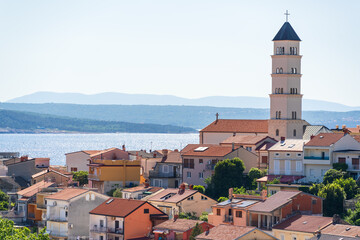 Fototapeta premium Panoramic view of a coastal Crikvenica town with church tower, Adriatic Sea, and sunny summer landscape