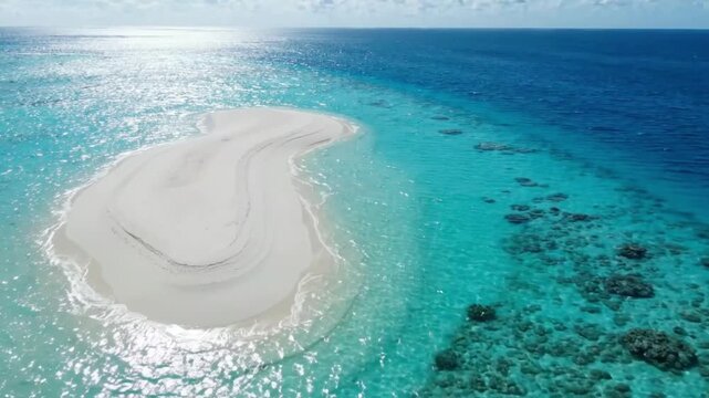 Aerial view of a remote tropical sandbar in crystal clear ocean water