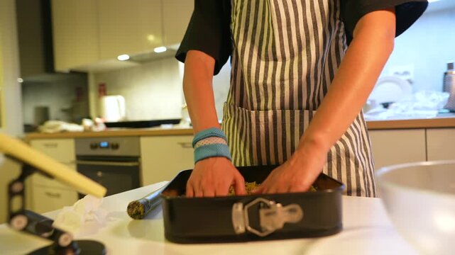 Keenhanded chef readying sweet treat for chilling or baking