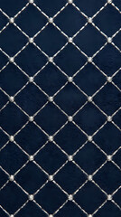 Fototapeta premium The image displays a pattern of intersecting lines forming diamonds on a dark blue surface.