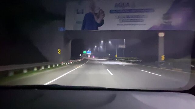 POV Driving on Highway at 4 AM.
Point of view (POV) dashcam footage of driving on an empty toll road highway at 4:00 AM.