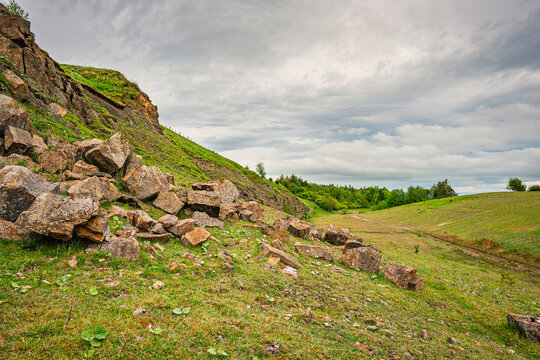 Fallen stones at Greenleighton Quarry, a disused Limestone Quarry now a Nature Reserve and is a Protected Area and SSSI in Northumberland, England, near Rothley