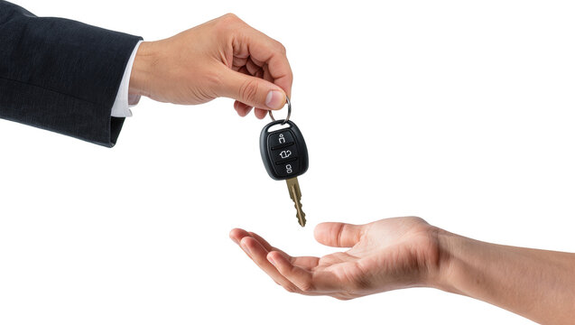 Isolated close-up of a hand in a suit giving car keys to another person, rental exchange.