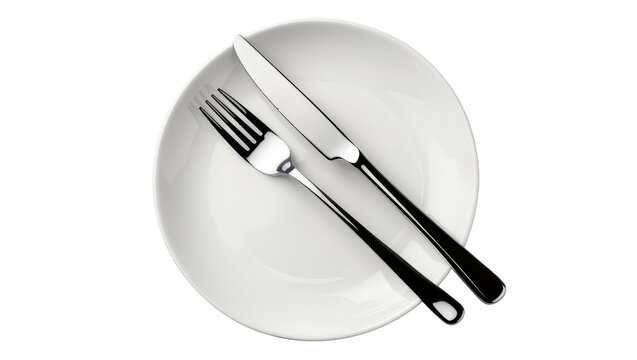 Isolated formal place setting with a clean white dinner plate and gleaming metal fork and knife.