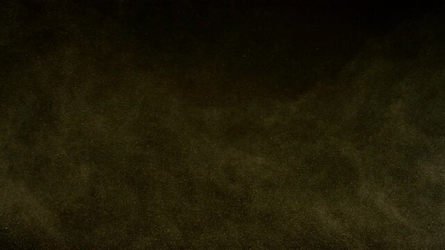 Super Slow Motion Shot of Flying Sand Powder , Isolated on Black Background , Filmed on High Speed Cinematic Camera at 1000 FPS