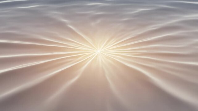 Golden sunlight reflection on calm water ripples with starburst flare