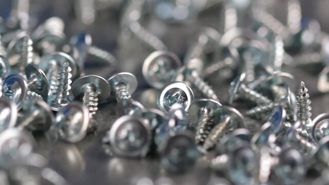 Metal screws for fastening equipment. Soft focus. Close-up. 