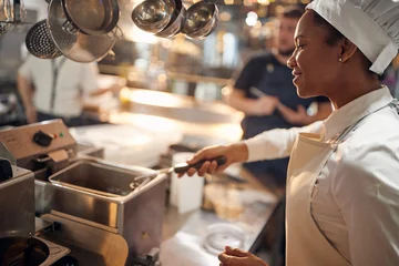 french fries potato in basket. Cook in Professional Modern  kitchen, restaurant concept © luckybusiness