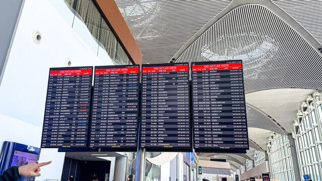 Airport departures board in a bright modern terminal with natural light suitable for travel blog airline marketing editorial and newsroom imagery, 5 May 2026 Antalya, Turkey