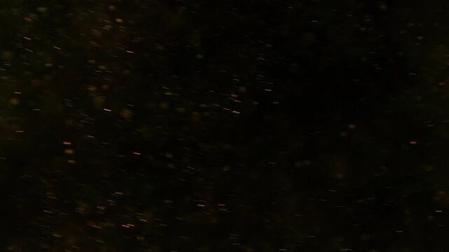 Flying Sparks Isolated on Black Background. Filmed on High Speed Cinema Camera