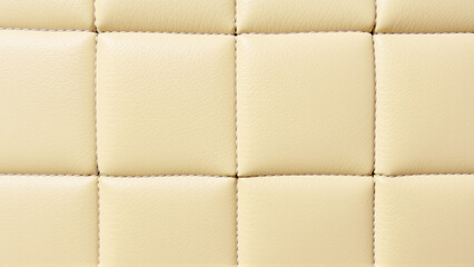 Naklejka premium Quilted tan leather upholstery texture