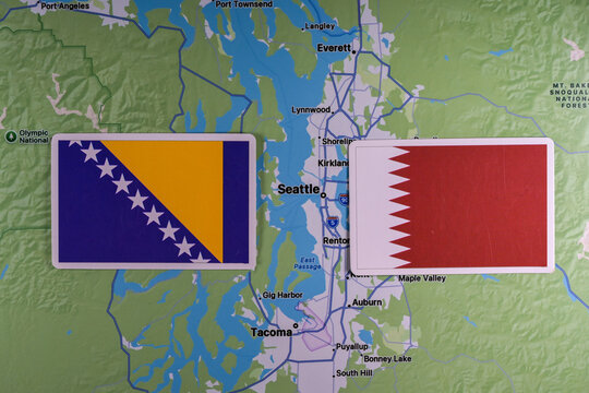 June 9, 2026, United States. Flags of the participants of the FIFA World Cup group stage of the national teams of Bosnia and Herzegovina and Qatar on the background of the Seattle map.