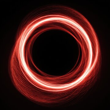 A vibrant red, circular light effect against a black background. The illuminating shape resembles swirling energy