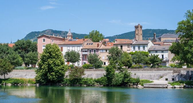 Millau, Aveyron, France : panoramic view of the historic town center along the Tarn River with church towers and surrounding hills in southern France.