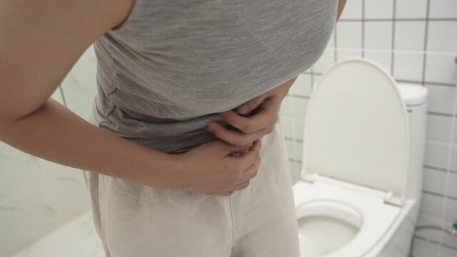 Constipation and diarrhea in bathroom. Hurt woman touch belly  stomach ache painful. colon inflammation problem, toxic food, abdominal pain, abdomen, constipated in toilet, stomachache, Hygiene