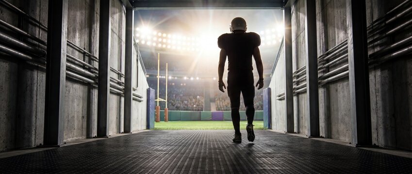 American football player entering stadium from tunnel before big game. Concept of game day pressure, athlete confidence, stadium entrance, comeback story and high stakes sport. Banner