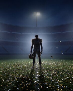 American football player standing alone on empty field after emotional night game. Concept of post-game defeat, career pressure, lonely setback, comeback mindset and sports resilience.