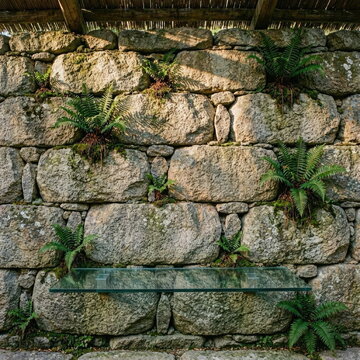 Minimalist Palloza Interior with Negative Space and Granite Wall
