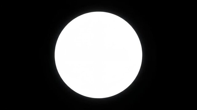 Luminous white circle centered on a dark black background.