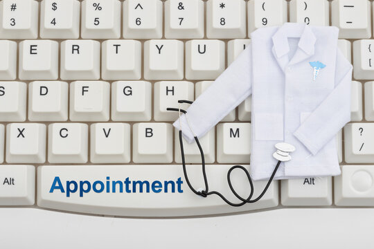 Online doctor appointment booking and telehealth concept on computer keyboard