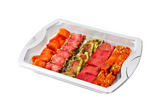 raw mini meat products in plastic tay isolated on white