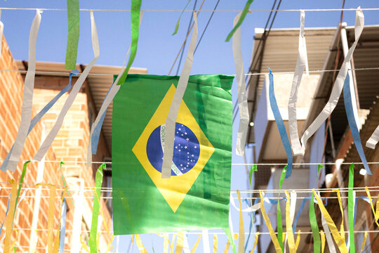 A street in Brazil decorated with Brazilian flags, ribbons, shirts, and World Cup paraphernalia. Rio de Janeiro, Brazil. 