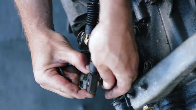 old gear shift box from a front-wheel drive car installing cables and shifting gears disassembly for repair vertical video