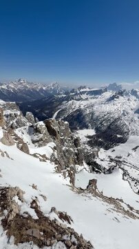 Breathtaking panoramic view above Cortina d&rsquo;Ampezzo in Dolomiti Superski. Snow-covered peaks, dramatic cliffs and endless alpine landscapes in the heart of the Dolomites