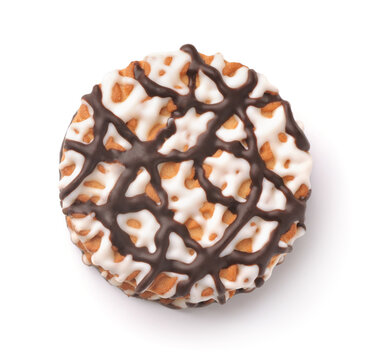 Top view of frosting drizzled round cookie