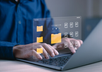 Business professional managing digital files on laptop with virtual document system, cloud storage, data organization, file management, information technology, workflow automation and paperless office © PB Studio Photo