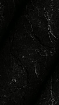 Shungite Coal texture featuring ancient carbon mineral structures rotating gently to highlight authentic healing stone surface details and unique patterns